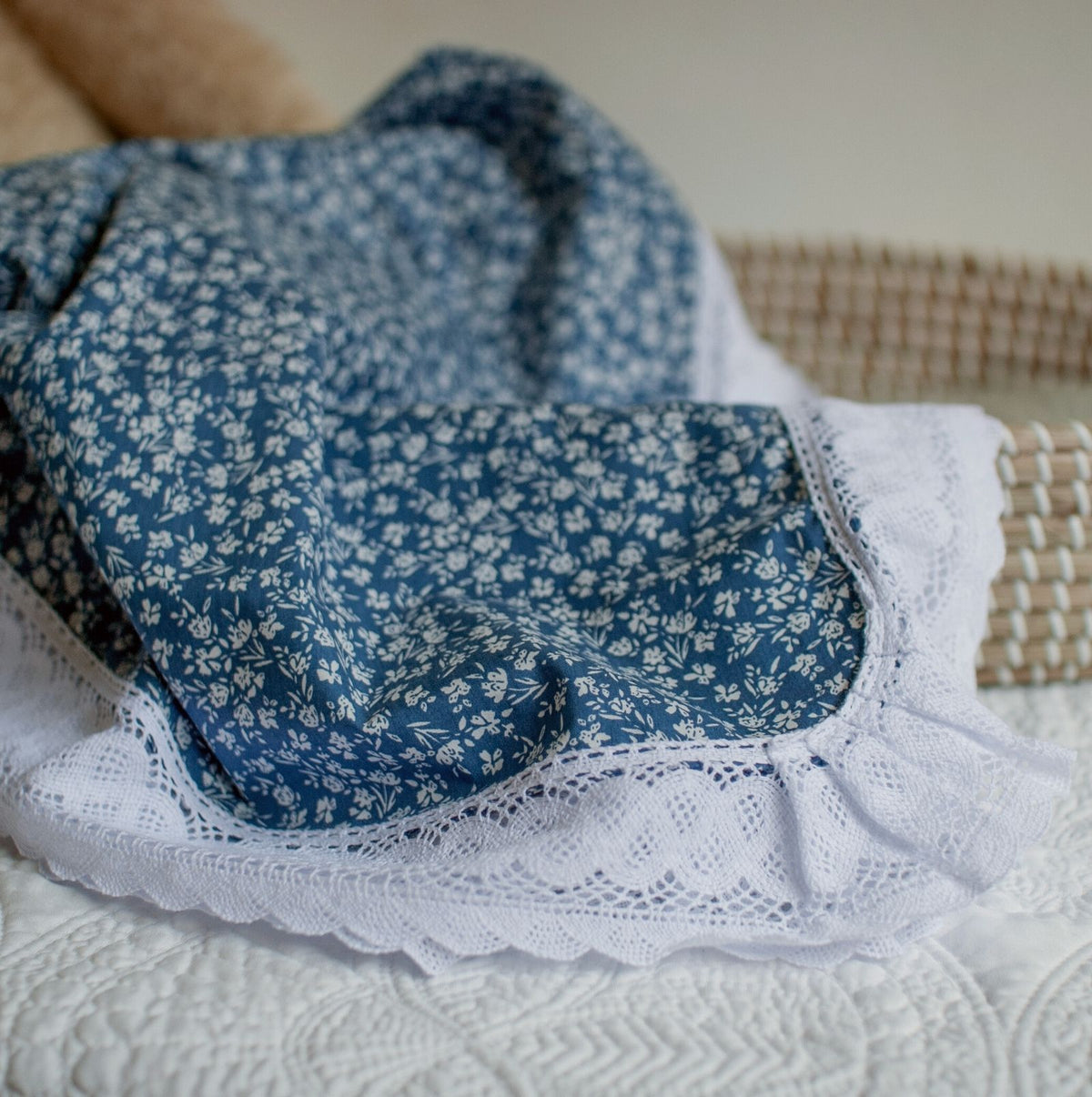cotage navy floral and lace edged baby blanket