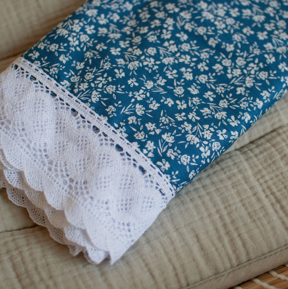 Navy blue floral baby blanket with a lace edging for a keepsake of heirloom