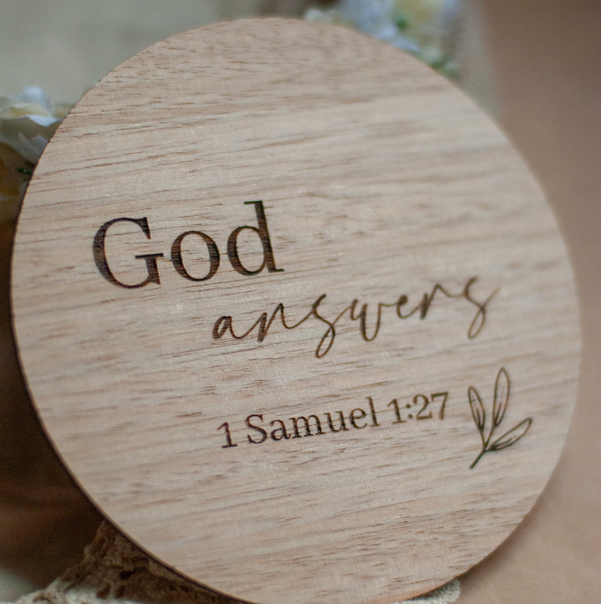 1st Samuel 1:17 bible quote etched onto a timber milestone disck t for Christioan mothers to use in their pregnancy or birth announcement photos