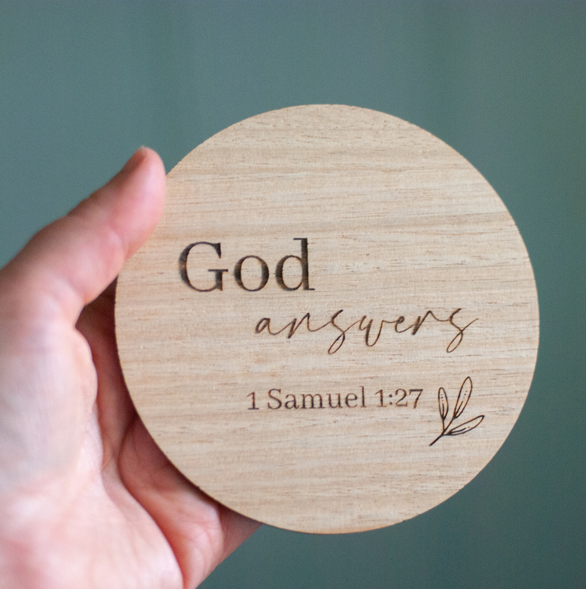 A Christian bible quote frm 1st Samuel 1:27 etched on a wooden disc to announce a pregnancy or birth and to use in photography